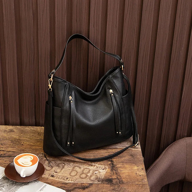 Coralie™ | Usnjena torba s frufruji